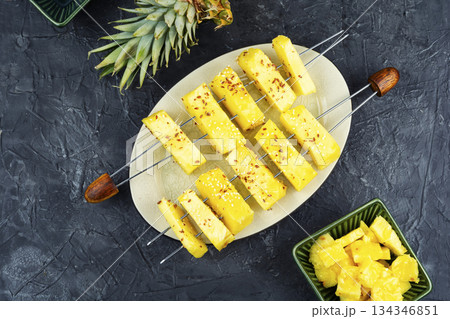 Pineapple chunks on wooden sticks. Pineapple chunks on wooden sticks. 134346851