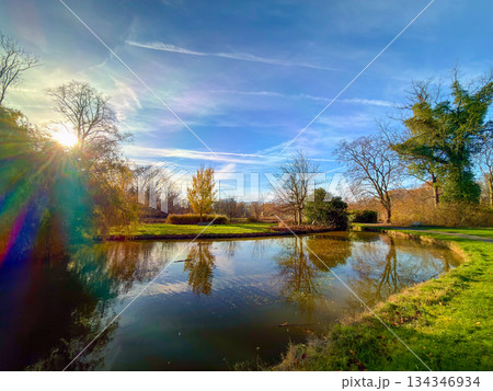 Idyllic water scene with gentle sunlight and tranquil surroundings Idyllic water scene with gentle sunlight and tranquil surroundings 134346934