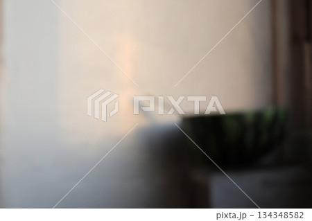 The eaten half of a watermelon on the veranda. 134348582