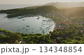 Padang Bai harbor on Bali island at sunset, fishing boats and ferries anchored in bay, coastal town nestled among lush green hills under soft light. Tropical paradise. Aerial view drone panorama Padang Bai harbor on Bali island at sunset, fishing boats and ferries anchored in bay, coastal town nestled among lush green hills under soft light. Tropical paradise. Aerial view drone panorama 134348854