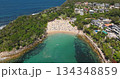 Australia, Sydney: aerial view crowded Manly Beach, people enjoying clear turquoise ocean water bay and sand shore, surrounded by lush green headlands and coastline residences. Aerial drone footage Australia, Sydney: aerial view crowded Manly Beach, people enjoying clear turquoise ocean water bay and sand shore, surrounded by lush green headlands and coastline residences. Aerial drone footage 134348859