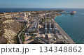 Malta: Delimara Power Station in Marsaxlokk, Malta, featuring the power plant infrastructure and an LNG tanker supplying fuel for energy production. Drone flight aerial view Malta: Delimara Power Station in Marsaxlokk, Malta, featuring the power plant infrastructure and an LNG tanker supplying fuel for energy production. Drone flight aerial view 134348862