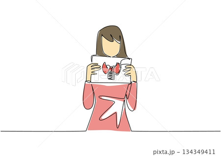 Single one line drawing a woman in casual clothes holds a paper with a mockup of a thyroid gland with both hands. Disease. Treatment. World Thyroid Day. Continuous line design graphic illustration 134349411