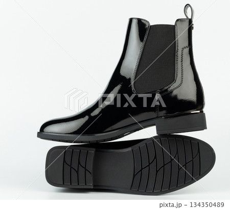 Black leather boots on white background for online retail display 134350489