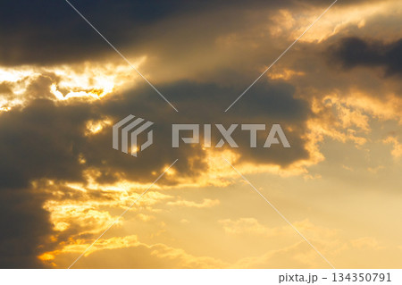 dramatic sunset sky with clouds. beautiful nature background in golden evening light. telephoto shot. leadership corporate wallpaper 134350791