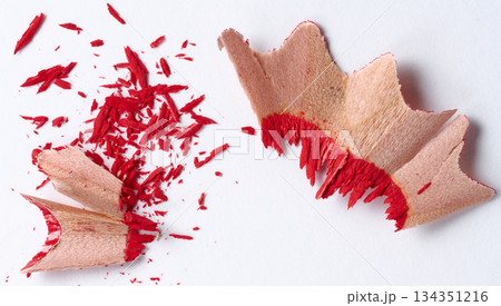 Wooden red shavings of lead pencil on white background, top view 134351216