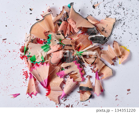 Close-up of a pile of spiral shavings from sharpening colored pencils on a white background Close-up of a pile of spiral shavings from sharpening colored pencils on a white background 134351220