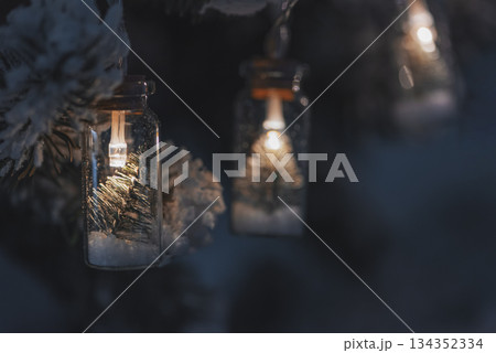 Christmas Tree with Bottle Lights and Miniature Pine Decorations. Soft focus 134352334