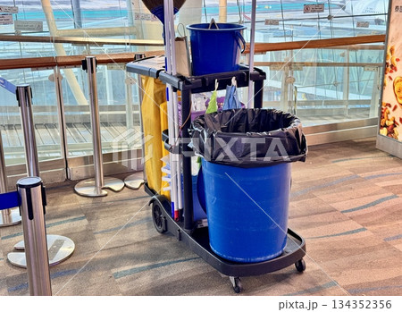 blue bucket for cleaning at the international airport. High quality photo 134352356