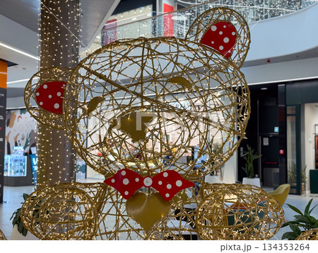 Christmas teddy bear light installation in shopping mall interior. Festive decoration, holiday joy, playful design, seasonal display and cheerful winter celebration atmosphere 134353264