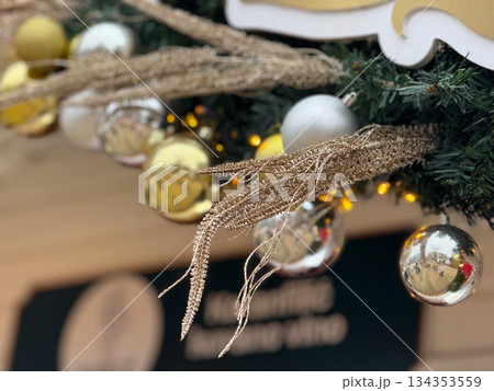 Gold and silver Christmas ornaments with glitter decor detail. Elegant holiday decoration, festive close up and seasonal winter mood 134353559