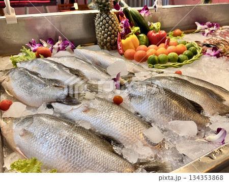 fresh raw fish is placed on ice for cooking fresh raw fish is placed on ice for cooking 134353868