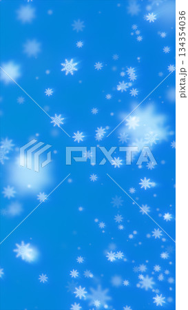 Soft falling white snowflakes drifting across a bright blue winter background 134354036
