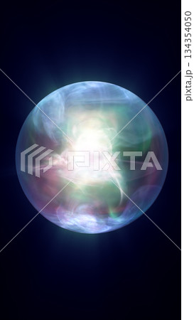 Ethereal glowing energy sphere emitting colorful light in blue, green, and pink hues on dark background 134354050