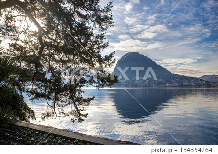 Ciani park with autumn leaf color in Lugano city AND TOPIARY TREES bLURRED MOTION PEOPLE Ciani park with autumn leaf color in Lugano city AND TOPIARY TREES bLURRED MOTION PEOPLE 134354264