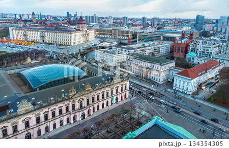 Aerial view on Berlin with museum with glass roof-Zeghous (part of Historical museum) - in distance lights of Christmas market Aerial view on Berlin with museum with glass roof-Zeghous (part of Historical museum) - in distance lights of Christmas market 134354305