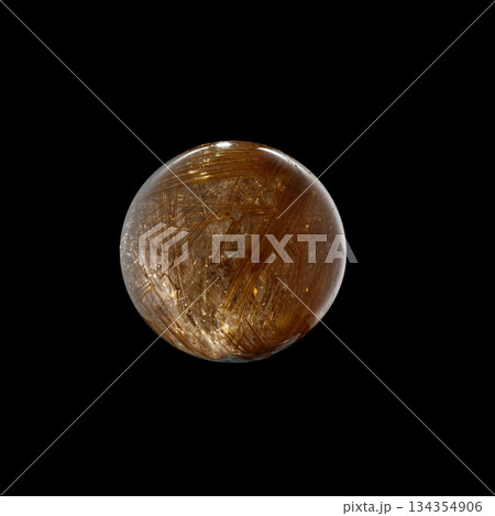 Ball of quartz with rutile on a black background 134354906