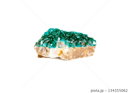 Macro mineral stone Dioptase silicate copper on a white background Macro mineral stone Dioptase silicate copper on a white background 134355062