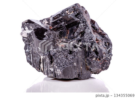 macro mineral stone sherle, schorl, black tourmaline on white background macro mineral stone sherle, schorl, black tourmaline on white background 134355069