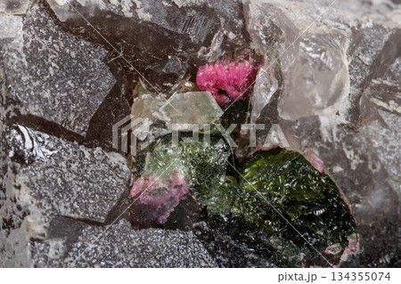 Macro mineral tourmaline stone in quartz on a white background Macro mineral tourmaline stone in quartz on a white background 134355074