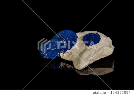 Macro mineral stone Azurite in siltstone against black background Macro mineral stone Azurite in siltstone against black background 134355094