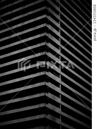 Bold brutalist design emphasizing stark contrasts and vertical rhythm Bold brutalist design emphasizing stark contrasts and vertical rhythm 134355608