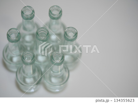 glass bottle arrangement, serene scene of glass bottles with subtle reflections for branding mockup glass bottle arrangement, serene scene of glass bottles with subtle reflections for branding mockup 134355623