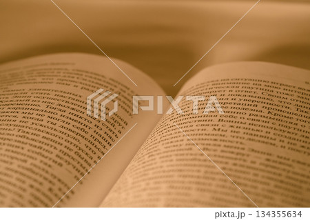 serene scholarly atmosphere showcasing vintage manuscript pages with warm sepia illumination serene scholarly atmosphere showcasing vintage manuscript pages with warm sepia illumination 134355634