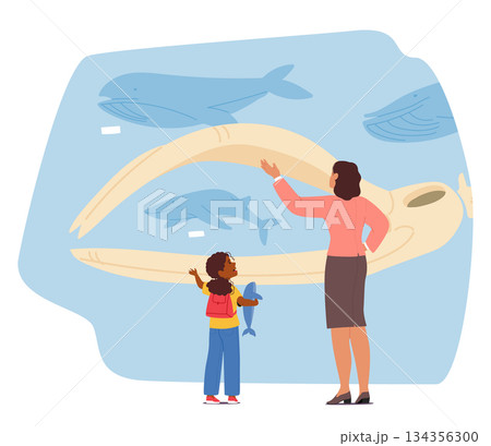 Teacher with schoolchild visiting oceanographic museum engaged in diverse science education 134356300