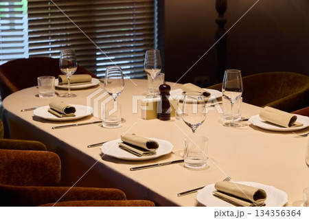 sophisticated table arrangement prepared, refined place setting prepared for culinary tasting 134356364
