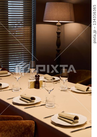 intimate evening dining arrangement, tranquil dining area illuminated gently with tasteful decor intimate evening dining arrangement, tranquil dining area illuminated gently with tasteful decor 134356365