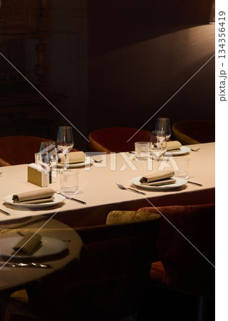ambient lighting and beautifully arranged table create professional social gathering ambiance ambient lighting and beautifully arranged table create professional social gathering ambiance 134356419