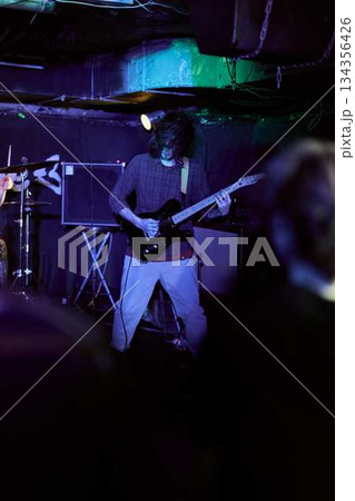 Silent Musician With Atmospheric Lighting, Subtle Musician In Dim Lighting With Deep Bass Fundamentals 134356426