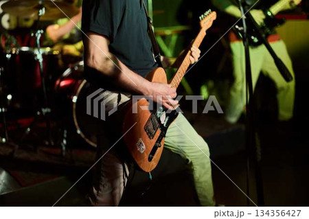 An Upclose Photograph Illustrating Precise Finger Positioning With Stage Illumination And Musical Intensity 134356427