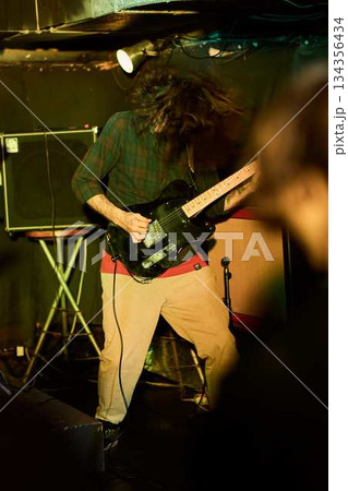 Heavily Distorted Riffs Energize Crowd, Vibrant Stage With Furious Riffs And Loud Amplification 134356434
