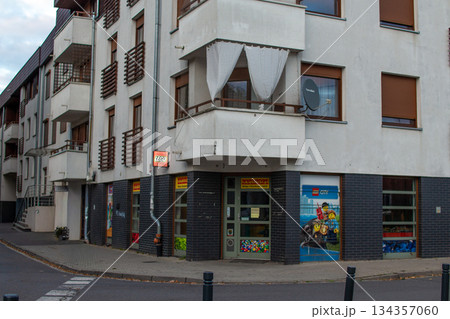 Brightly colored building with art-themed storefront in a residential area Brightly colored building with art-themed storefront in a residential area 134357060