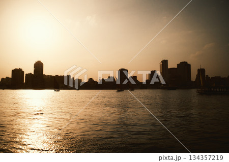 Sunset Reflection On The Nile River With Cairo Skyline Silhouette 134357219