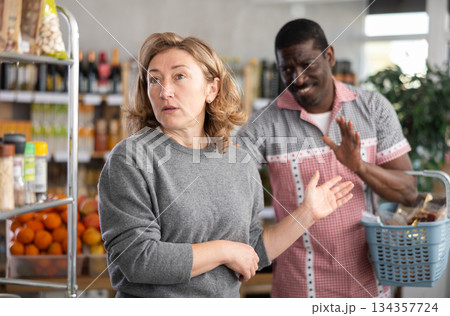 European wife and African husband, yells at each other in shop 134357724