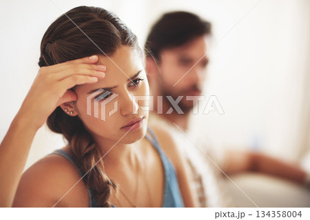 Unhappy, upset or conflict with a couple arguing about an affair or breakup on their home living room sofa. Depression, abuse or domestic violence with a sad woman thinking of divorce after a fight Unhappy, upset or conflict with a couple arguing about an affair or breakup on their home living room sofa. Depression, abuse or domestic violence with a sad woman thinking of divorce after a fight 134358004