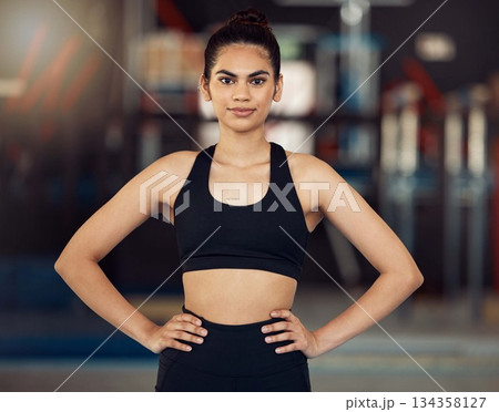 Fitness, motivation and healthy woman with wellness goal for workout, exercise and training in sports gym. Portrait of personal trainer, coach and power athlete with muscle building vision 134358127