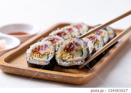 Kimbap, Korean food made from cooked rice with vegetables, egg and wrapped with dried seaweed Kimbap, Korean food made from cooked rice with vegetables, egg and wrapped with dried seaweed 134361627