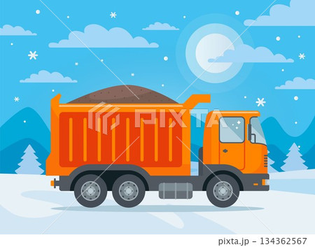 Truck with sand in winter. Loading bulk materials. 134362567
