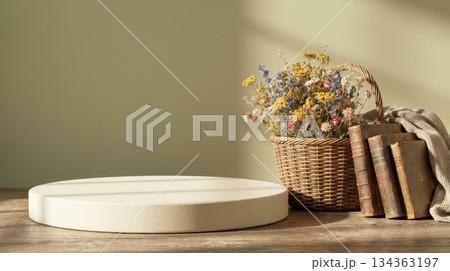 Cottage Podium with Wicker Basket of Flowers and Old Book 134363197