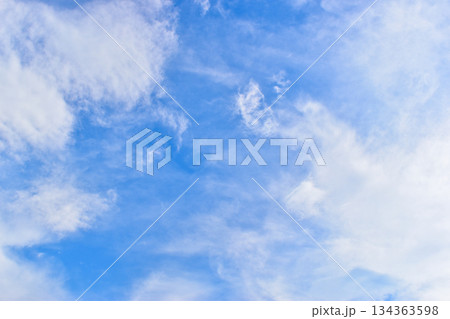 beautiful blue sky and white fluffy group of clouds with sunrise in the morning, natural background beautiful blue sky and white fluffy group of clouds with sunrise in the morning, natural background 134363598