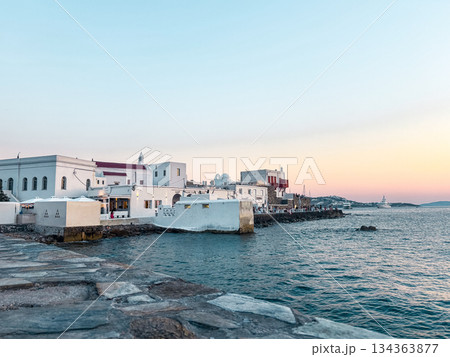 Mykonos little venice at sunset showing traditional cycladic architecture with whitewashed buildings along the aegean sea coastline 134363877