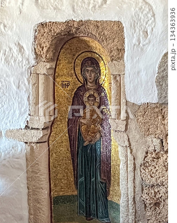 Virgin mary and infant jesus byzantine mosaic icon in a stone alcove, an ancient depiction of christian faith and art within a historic greek island church Virgin mary and infant jesus byzantine mosaic icon in a stone alcove, an ancient depiction of christian faith and art within a historic greek island church 134363936