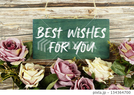Best Wishes For You text written on wooden plank with flower decoration on wooden background Best Wishes For You text written on wooden plank with flower decoration on wooden background 134364700