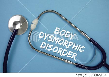 Body Dysmorphic Disorders text with Stethoscope on blue background 134365154