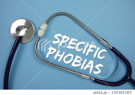 Specific Phobias text with Stethoscope on blue background Specific Phobias text with Stethoscope on blue background 134365165