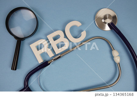 RBC Red Blood Cell text with Stethoscope and magnifying glass on blue background 134365168